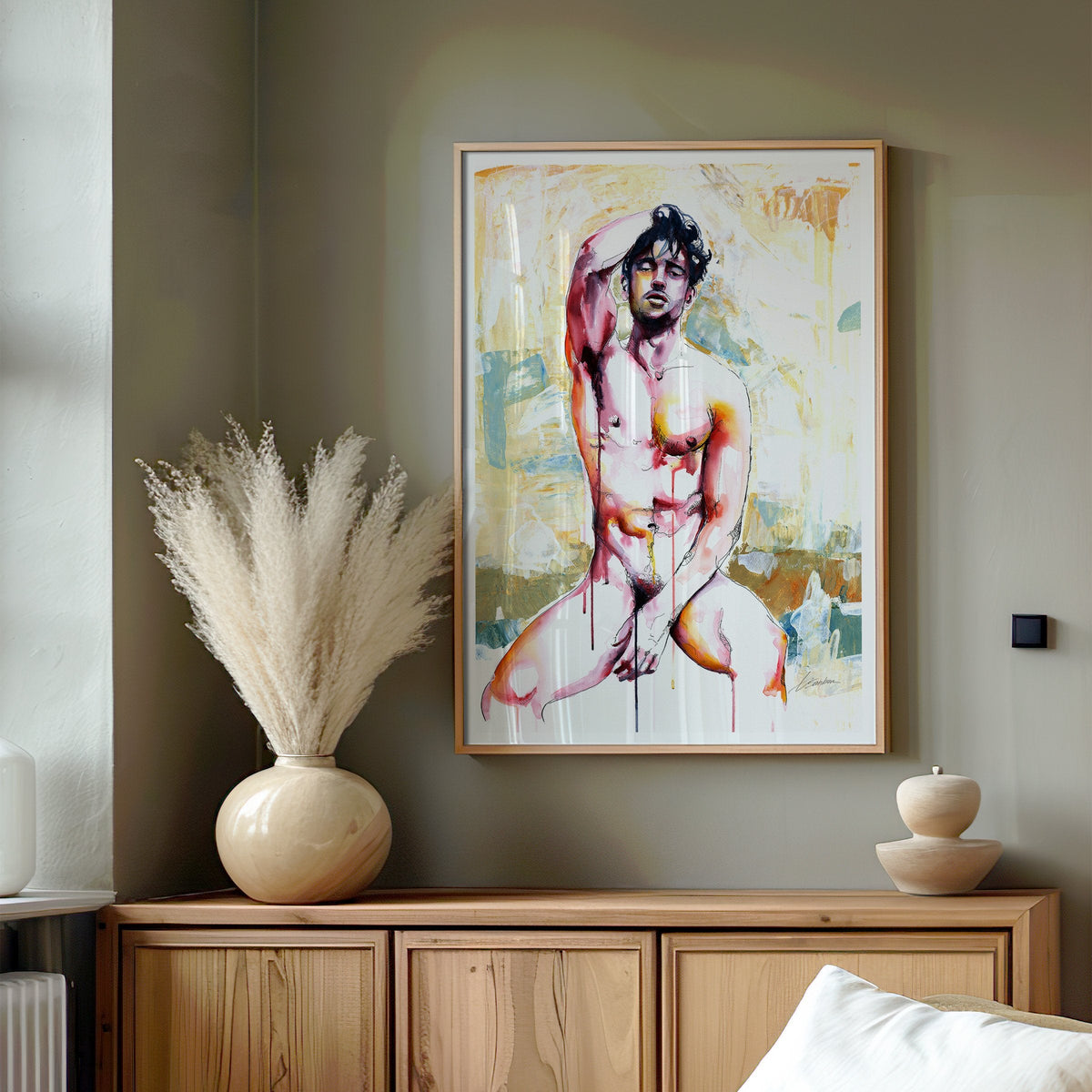 Drip watercolor male figure art print by Brenden Sanborn framed above a wood sideboard with pampas grass in a calm living room