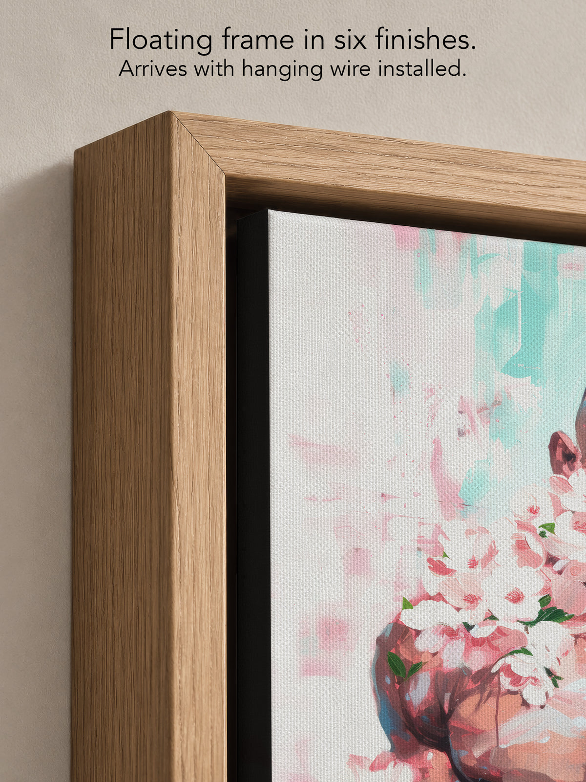 Close up corner of Pink Static in a natural oak floating frame, with black canvas edges and hanging wire installed