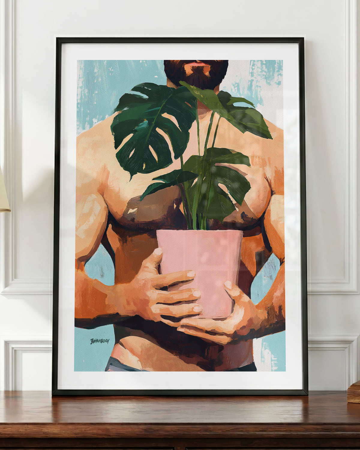 Small Jungle art print in a black frame, shown up close