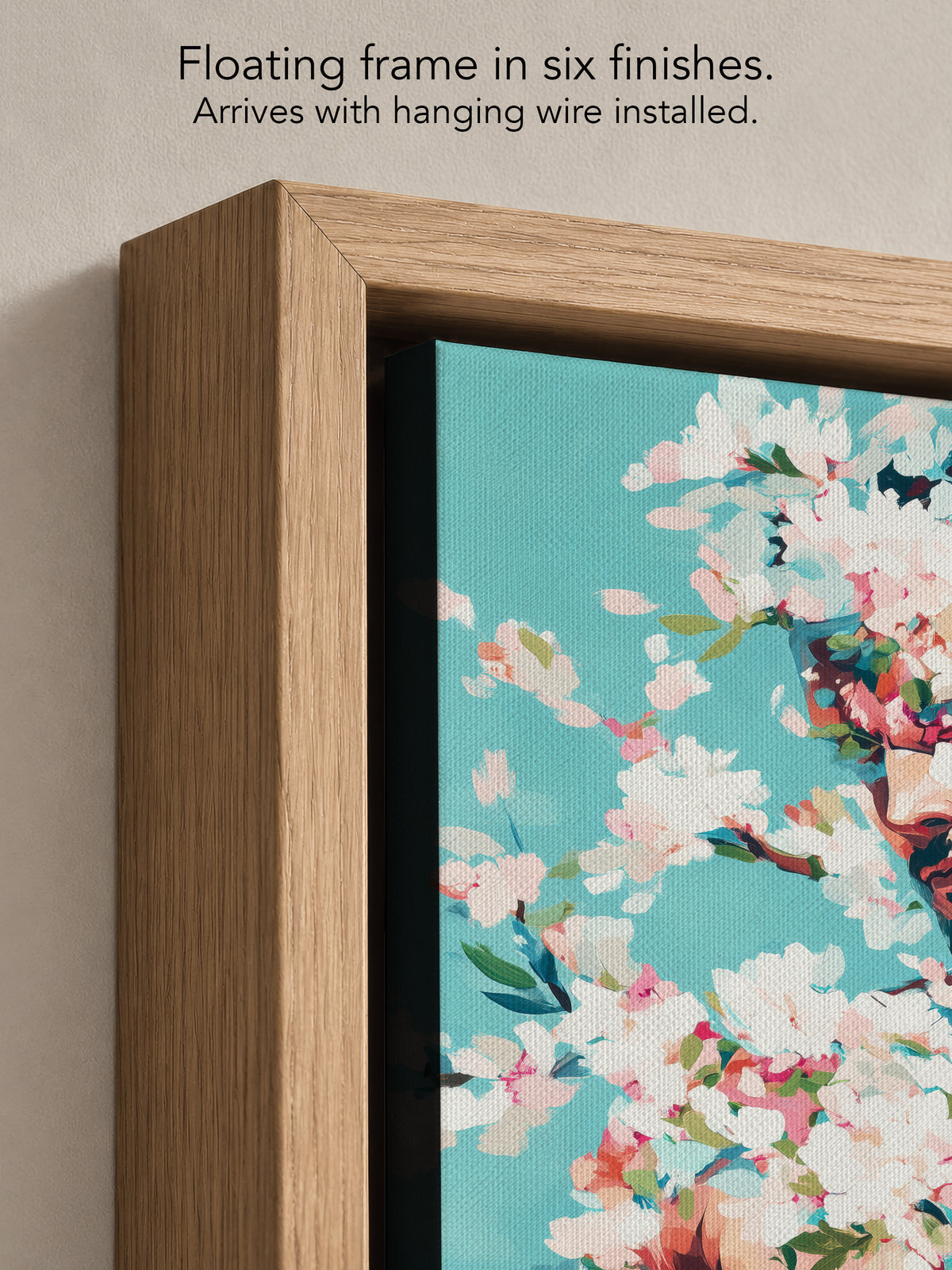 Close up corner of Soft Riot in a natural oak floating frame, with black canvas edges and hanging wire installed