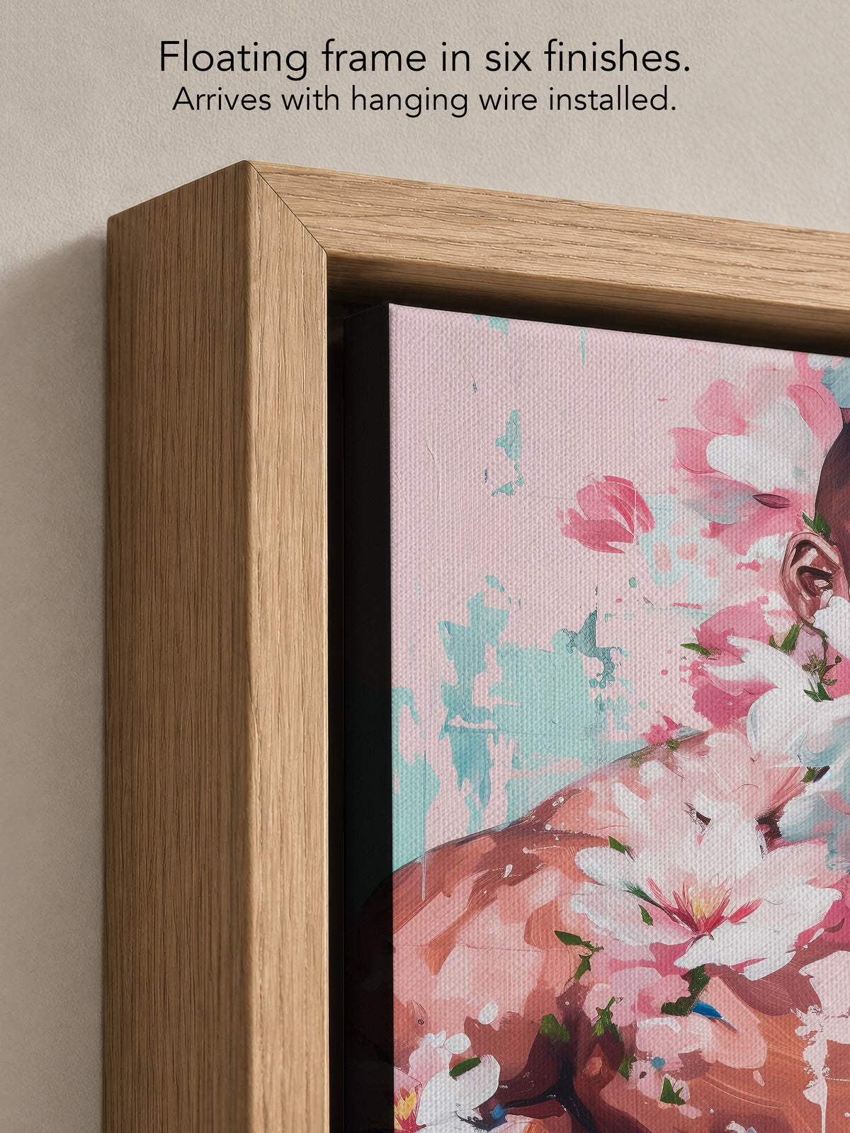 Close up corner of Sweet Drift in a natural oak floating frame, with black canvas edges and hanging wire installed