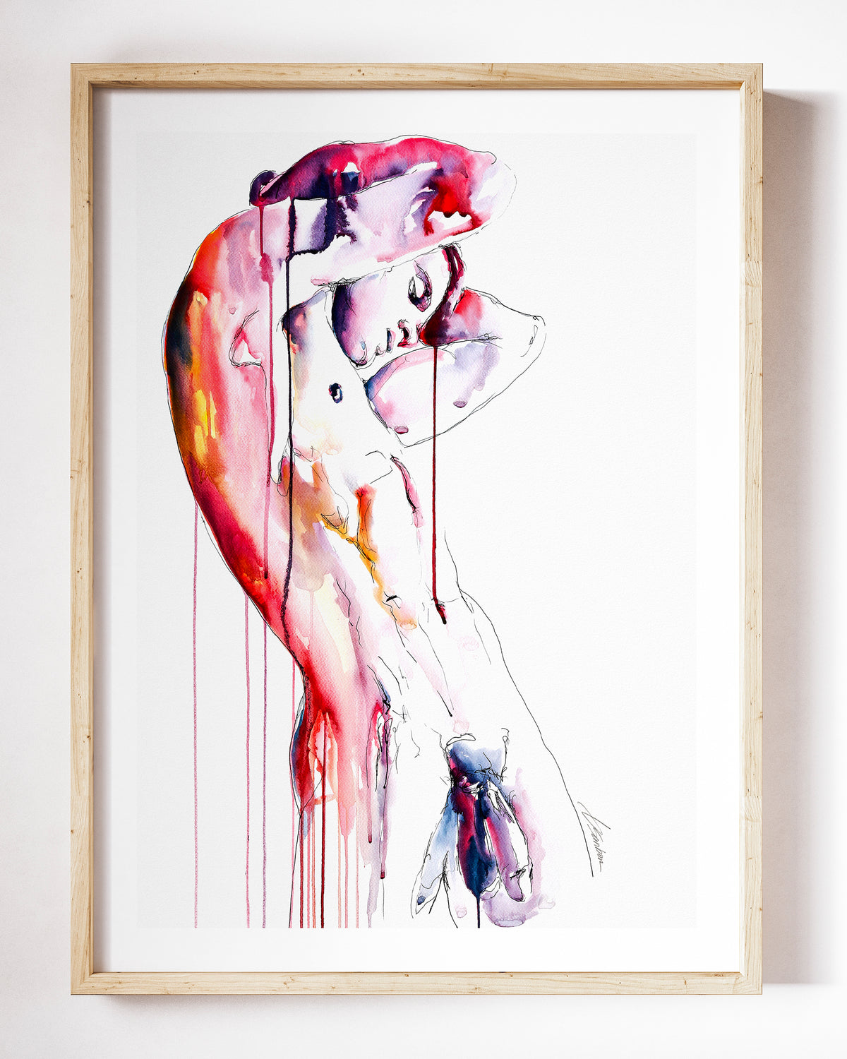 Unbound watercolor art print by Brenden Sanborn, a nude man arching back with one arm over his head, in rose and red drips, shown in a light wood frame on a white wall