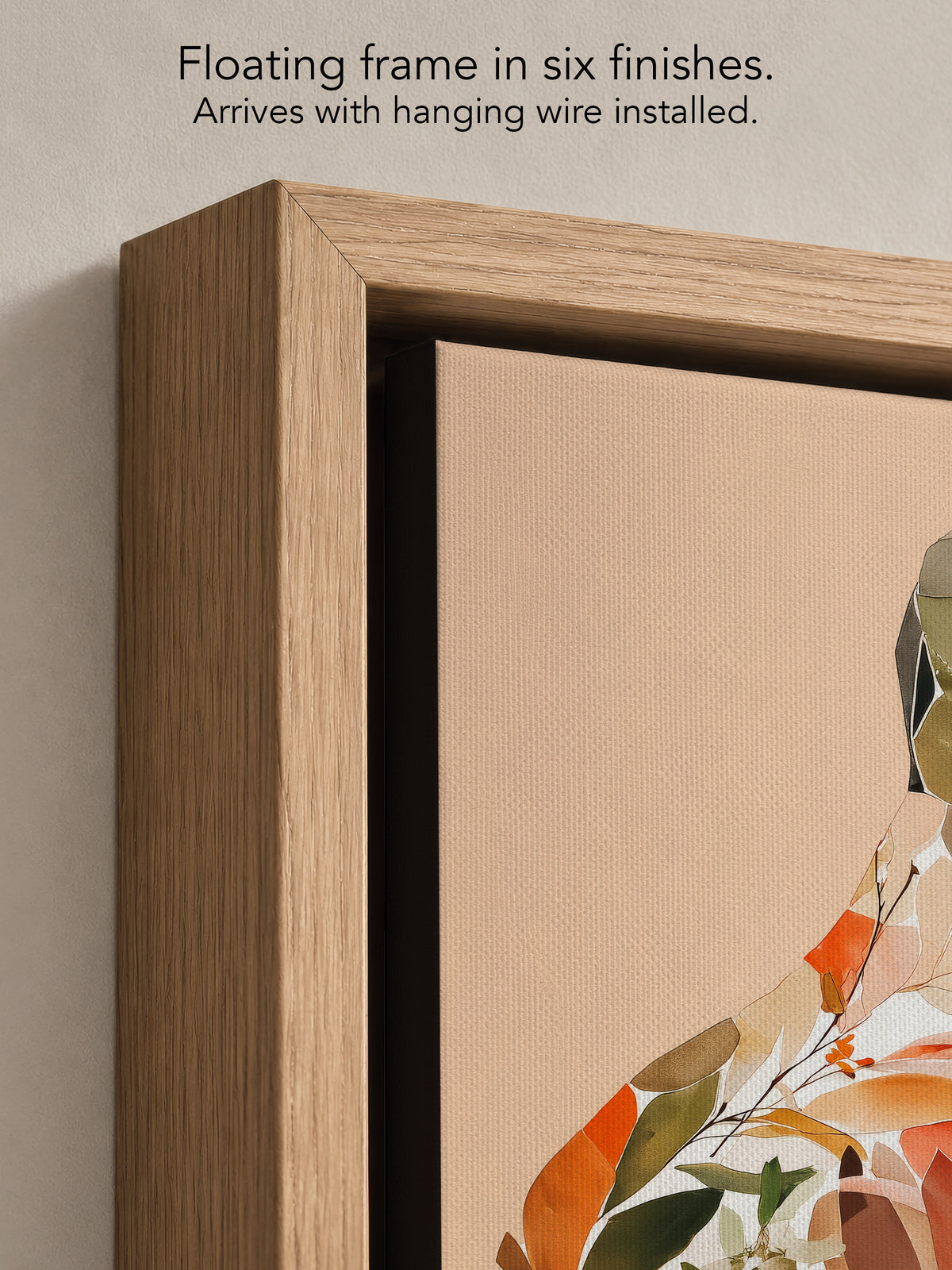 Close up corner of Autumn Inside in a natural oak floating frame, with black canvas edges and hanging wire installed