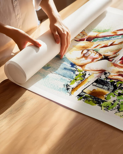 Hands unrolling the Garden Bench fine art paper print, showing the white border