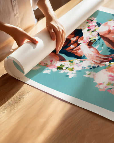 Hands unrolling the Low Bloom fine art paper print, showing the white border