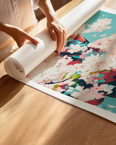 Hands unrolling the Pale Weather fine art paper print, showing the white border