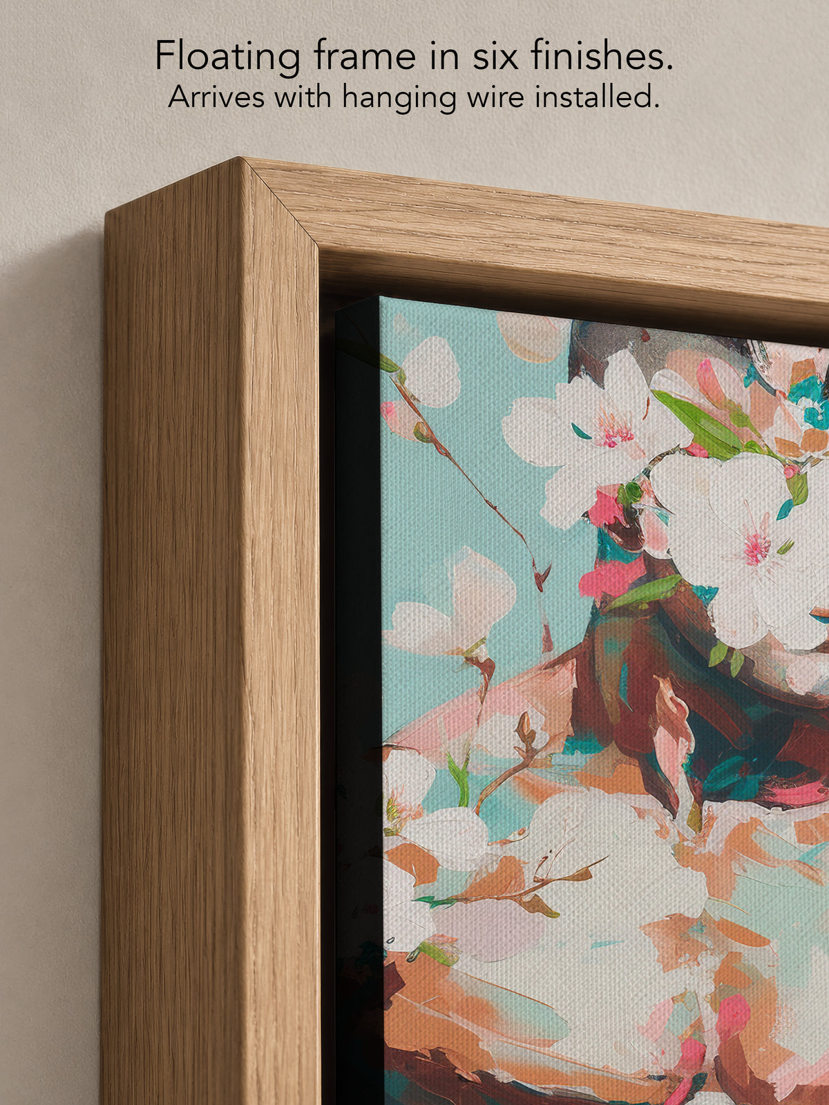 Close up corner of Quiet Orchard in a natural oak floating frame, with black canvas edges and hanging wire installed