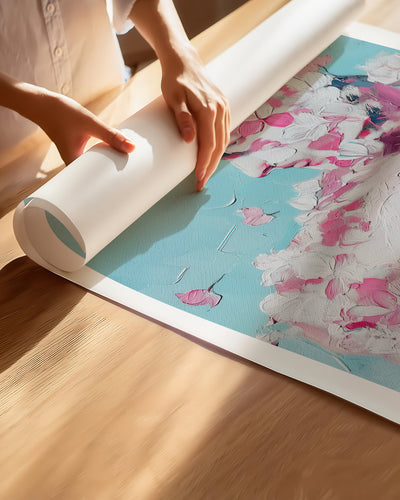 Hands unrolling the Rose Plaster fine art paper print, showing the white border