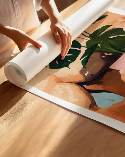 Hands unrolling the Small Jungle fine art paper print, showing the white border