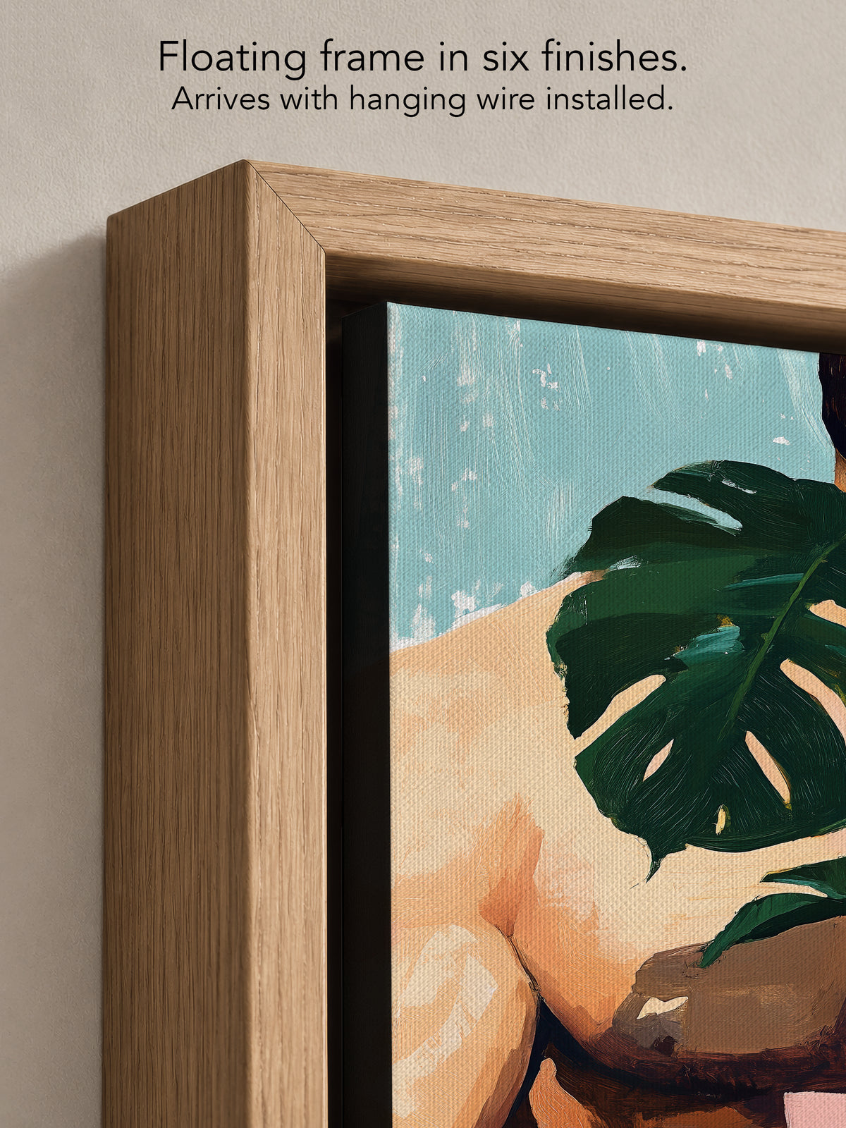 Close up corner of Small Jungle in a natural oak floating frame, with black canvas edges and hanging wire installed