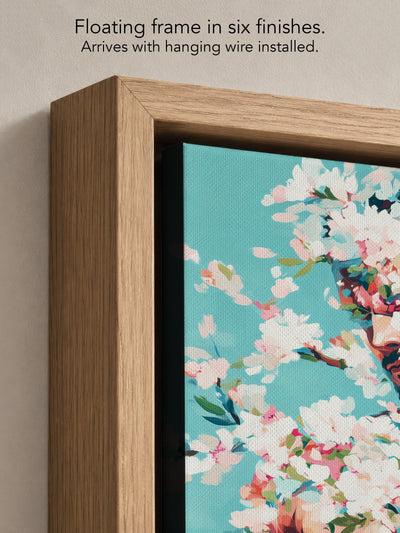 Close up corner of Soft Riot in a natural oak floating frame, with black canvas edges and hanging wire installed