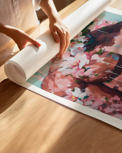 Hands unrolling the Sweet Drift fine art paper print, showing the white border