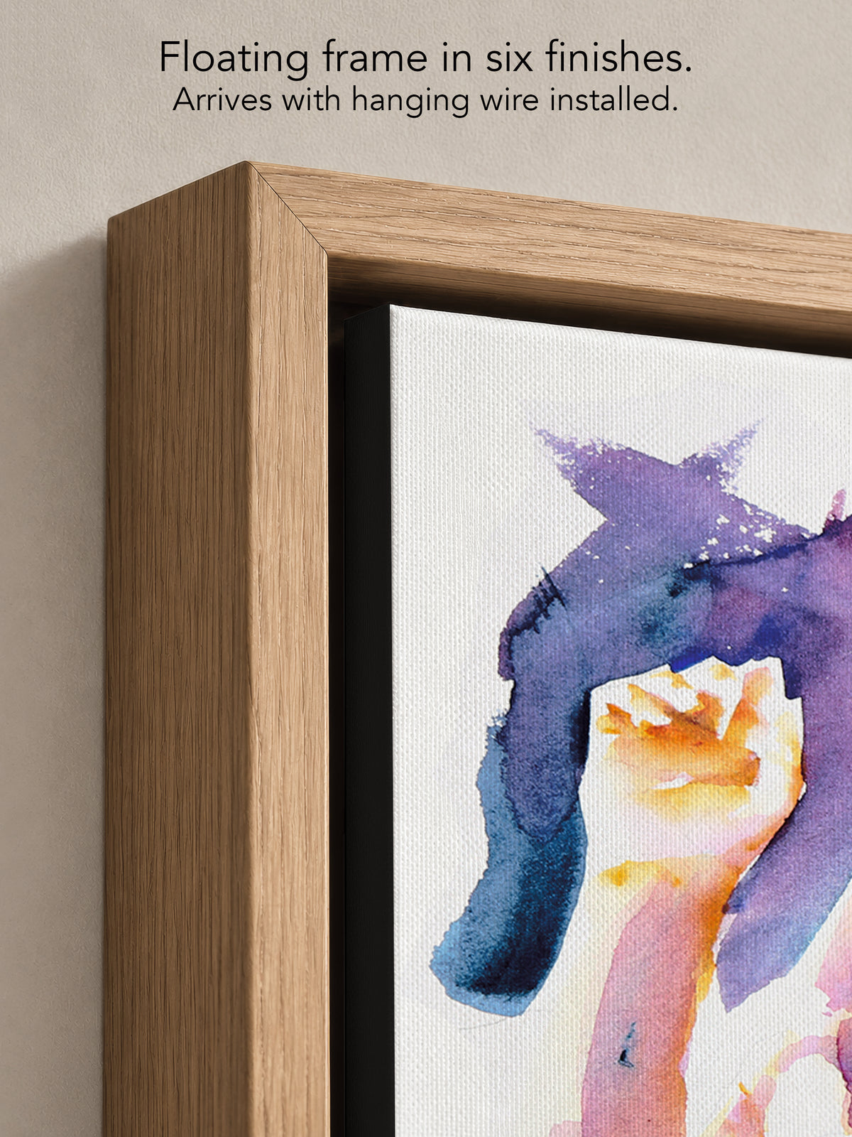 Close up corner of Wide Awake in a natural oak floating frame, with black canvas edges and hanging wire installed